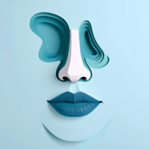 Abstract paper-cut illustration of a human face featuring layered teal shapes for the eyes, a sculpted white nose, and textured blue lips on a light blue background.